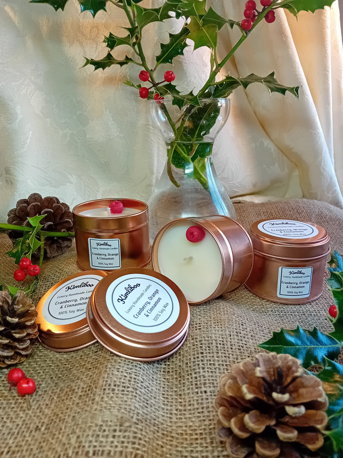 Small rose gold tin with Cranberry, Orange & Cinnamon fragranced candle and one cranberry wax decoration